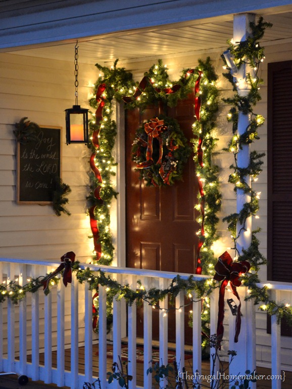 Our Christmas front porch (with hanging candle lanterns)