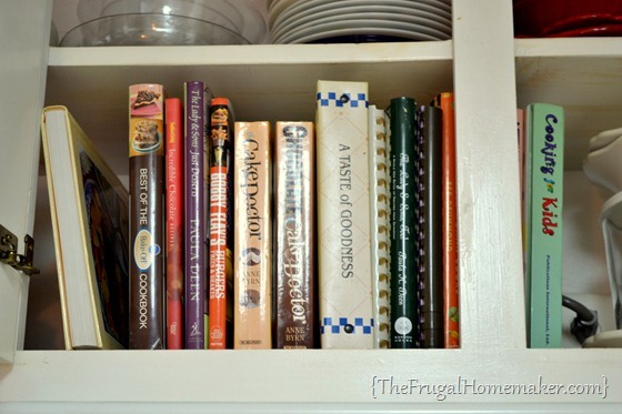 cookbooks in cabinet