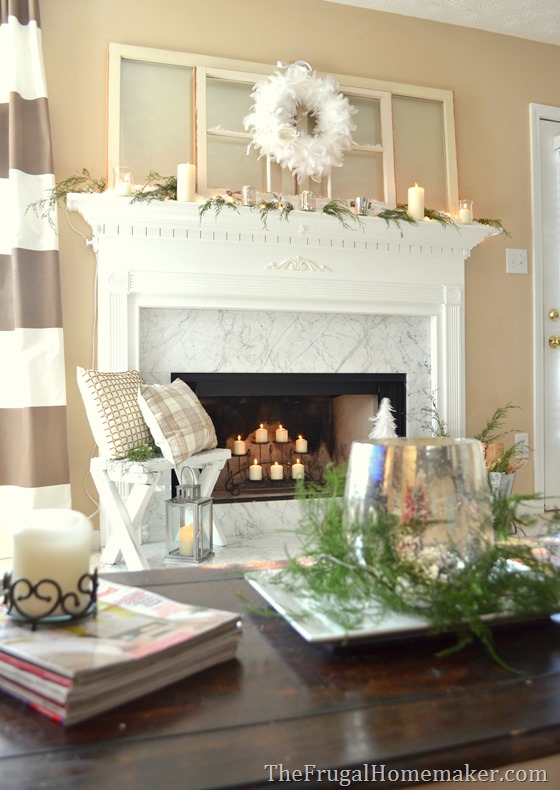 Winter white + green mantel dressed in candlelight