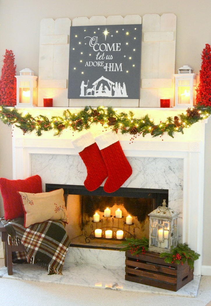 Red and festive Christmas mantel with DIY lit canvas
