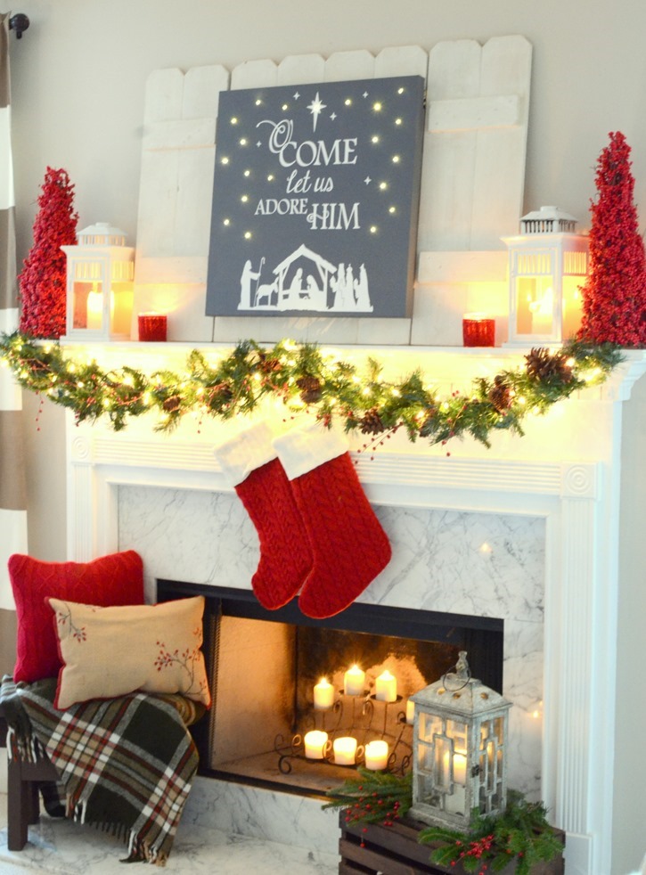 Red and festive Christmas mantel with DIY lit canvas
